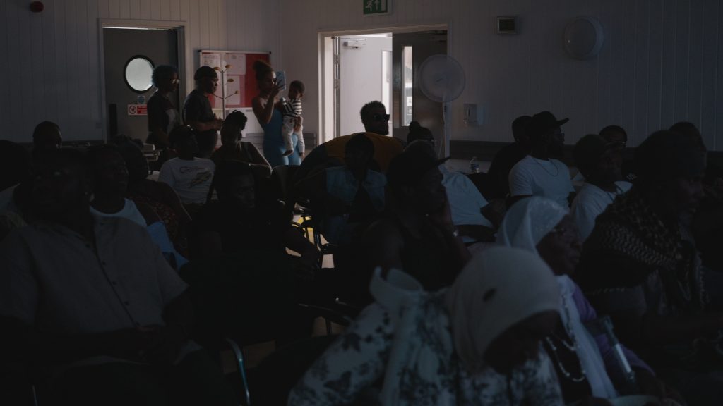 Guests watching a presentation at the launch event